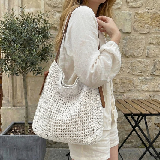 woman wearing white crochet tote bag, boho summer outfit, casual everyday shoulder bag