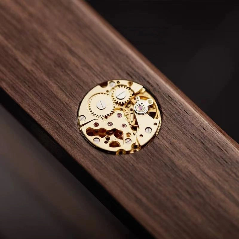 Close-up of the decorative gear-style metal accent on the Arden watch box