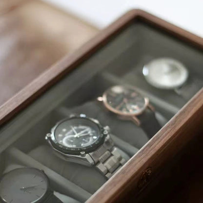 Arden black walnut watch box with watches visible through the glass lid