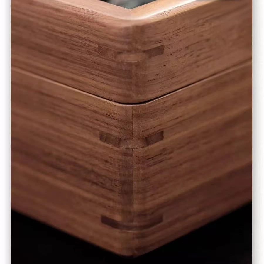 Close-up of the Arden walnut watch box rounded corners and beveled edges