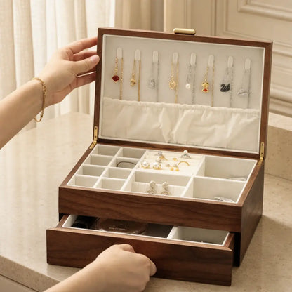 Double-layer black walnut jewelry box on a warm neutral vanity