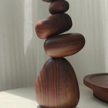 Close-up of Black Walnut magnetic wooden balance stones showing natural grain and balanced organic shapes
