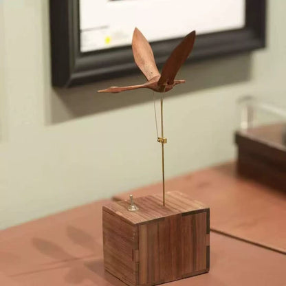Wooden swan kinetic desk sculpture with toggle switch