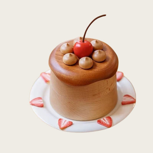 Cherry cake jewelry box in beech and dark wood with a red cherry topper