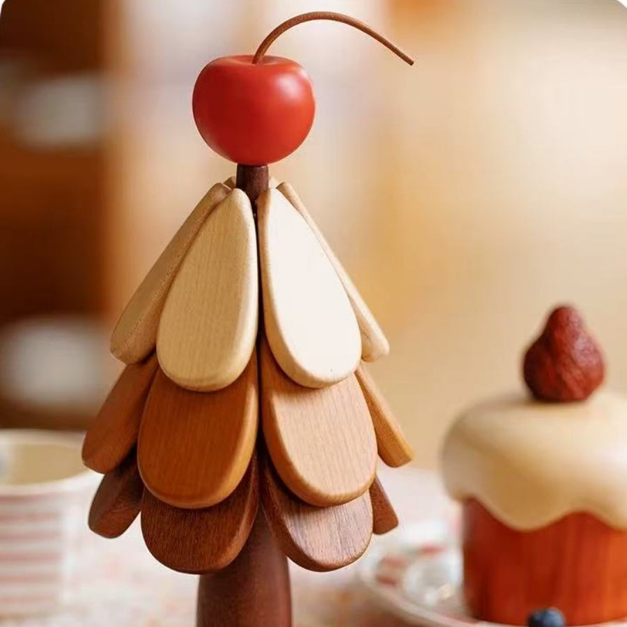 Cherry-topper Christmas tree trivet set displaying layered natural wood tones.