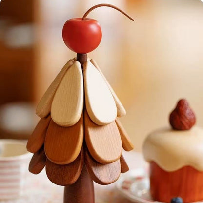 Cherry-topper Christmas tree trivet set displaying layered natural wood tones.