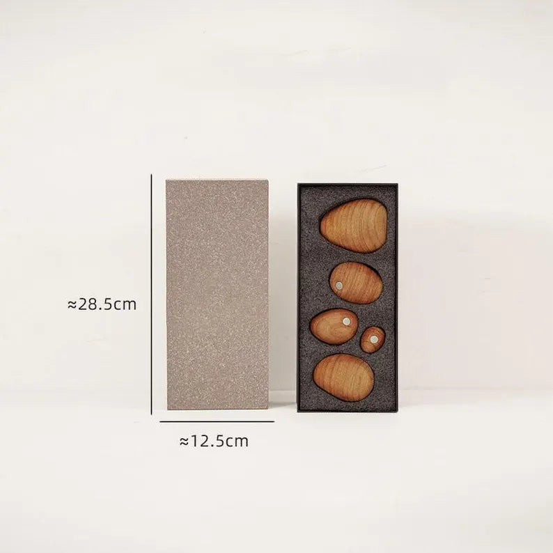 Cherry Wood magnetic wooden balance stones arranged inside a fitted gift box with an outer sleeve