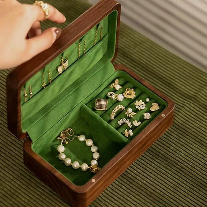 Small Fern walnut jewelry box with green velvet ring rolls and an open jewelry compartment