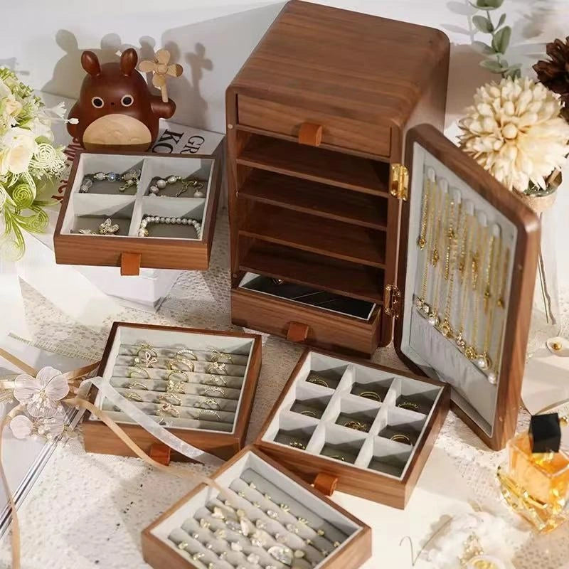 Haven wooden jewelry box with drawers displayed to show ring rows and divided jewelry compartments