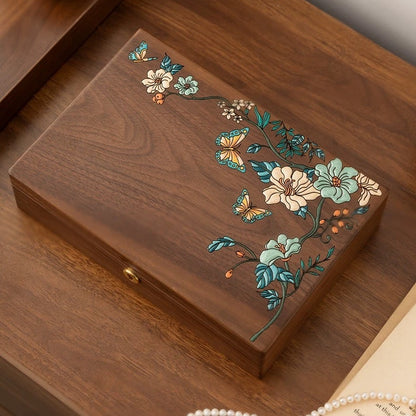Top view of Huadie walnut jewelry box with raised floral and butterfly artwork