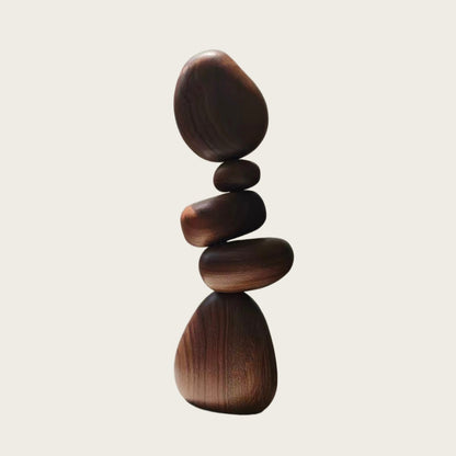Black Walnut magnetic wooden balance stones stacked into a sculptural display on a neutral background