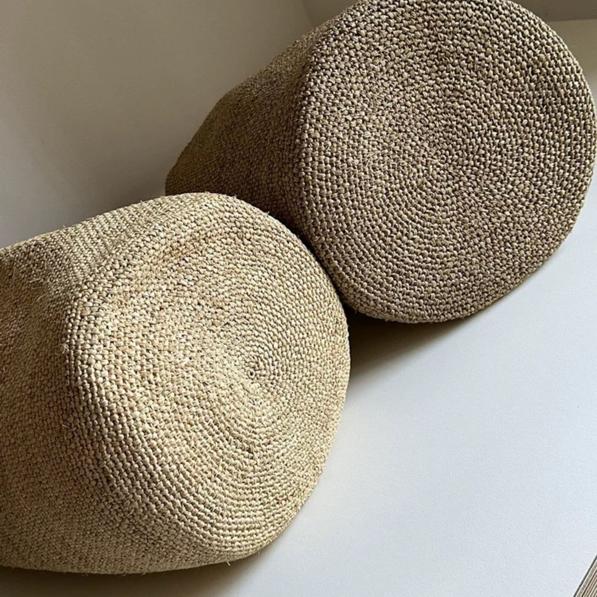 Natural handwoven raffia bucket tote bag round bottom detail