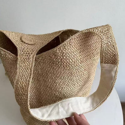 Natural handwoven raffia bucket tote bag with wide shoulder strap