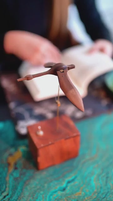 Black walnut swan sculpture motion demonstration 2