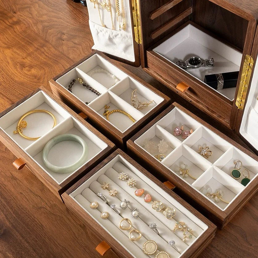Ivory-lined Solaris drawers displaying rings, earrings, bracelets and a watch