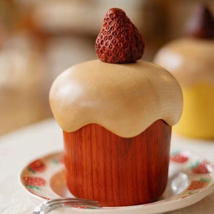 Close-up of the rosewood and maple strawberry cake storage box on a ceramic plate