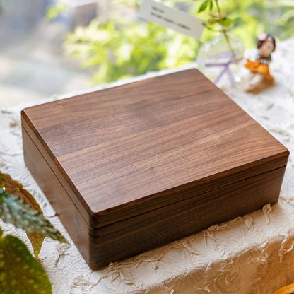 Closed Sylvan solid black walnut jewelry box showing natural wood grain and rounded corners