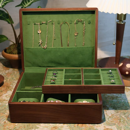 Open Sylvan walnut jewelry box with two storage layers on a dressing table