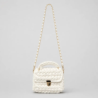 White chunky crochet top handle bag shown on a clean background with gold hardware and a detachable woven shoulder strap