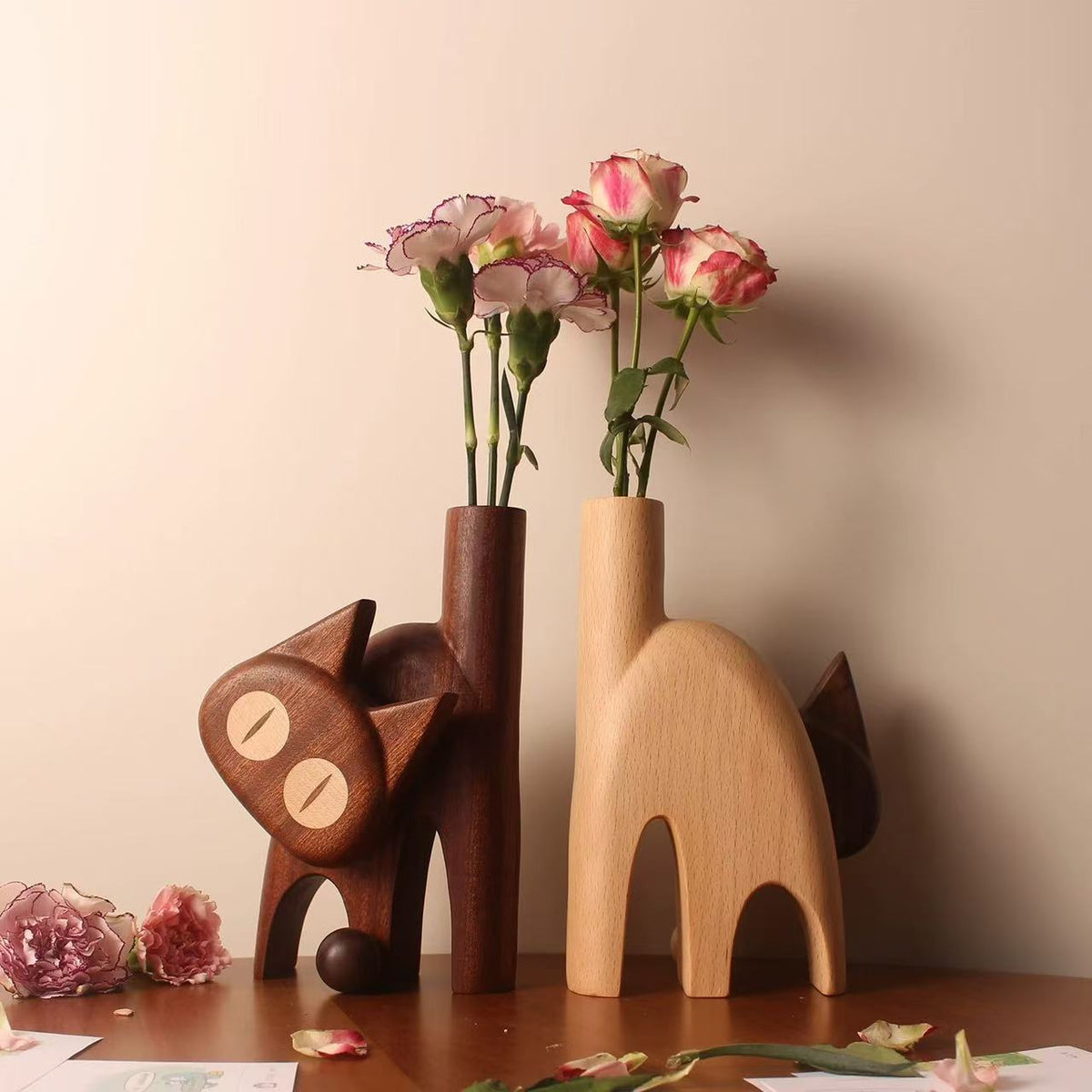Dark wenge and light beech wooden cat vase color options arranged with fresh flowers.