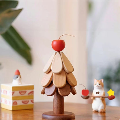 Wooden Christmas tree trivet set assembled as tabletop decor with a red cherry topper.