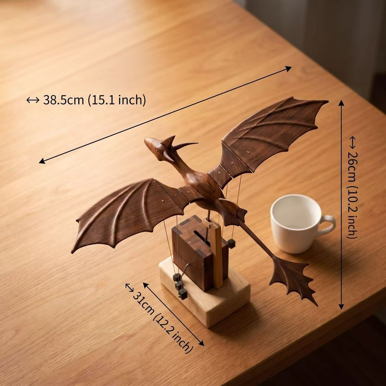 Size guide for the wooden dragon automaton showing its 38.5 cm length and 31 cm width.